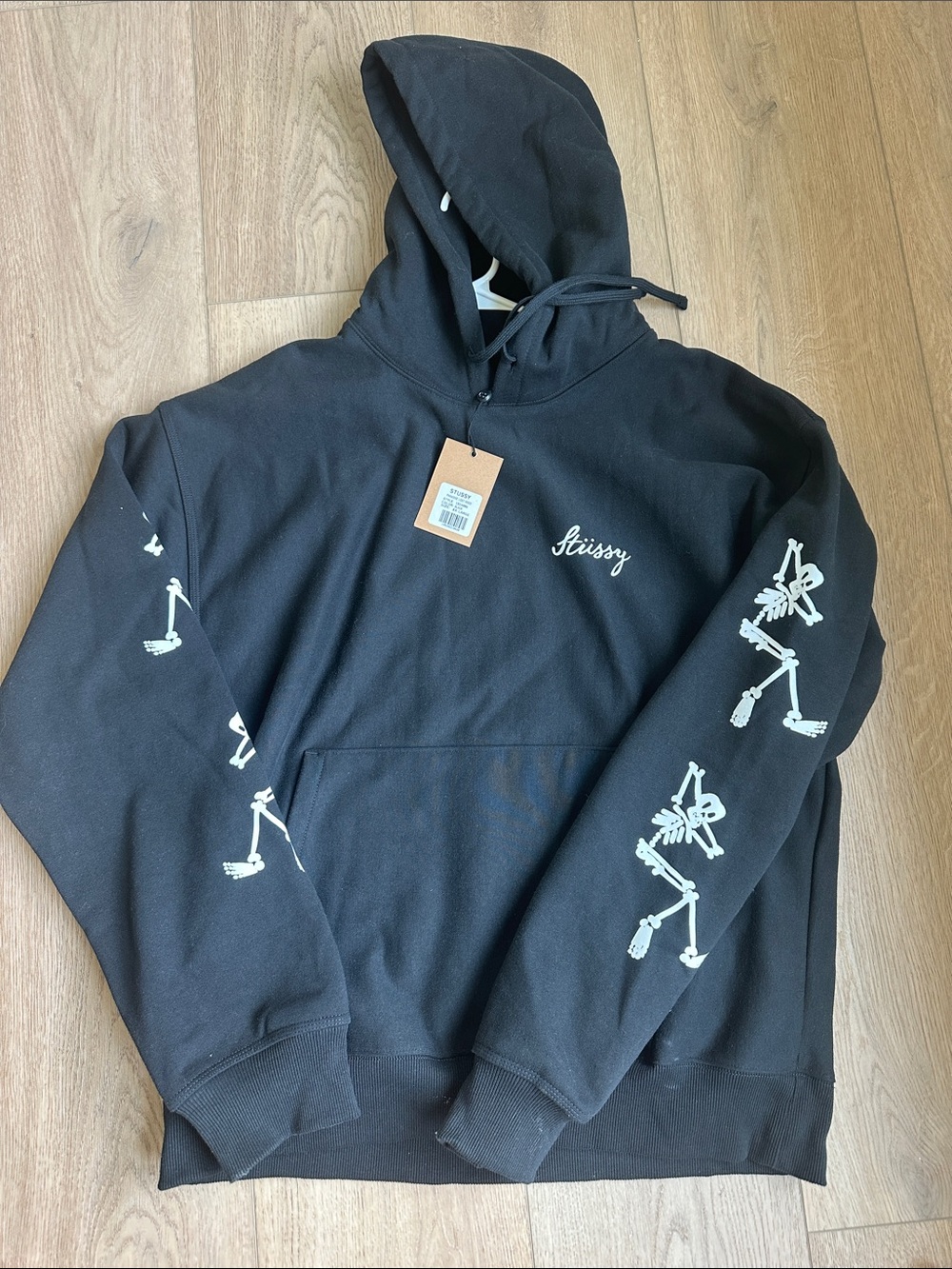 Stussy Black Pullover Hoodie with White Sleeve Skeletons